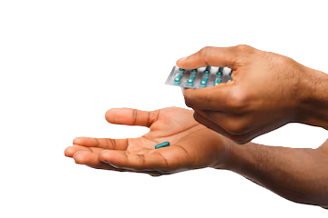 hand holding pills from a sachet